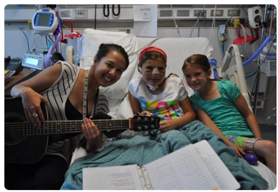 Music Therapist and patient in hospital room