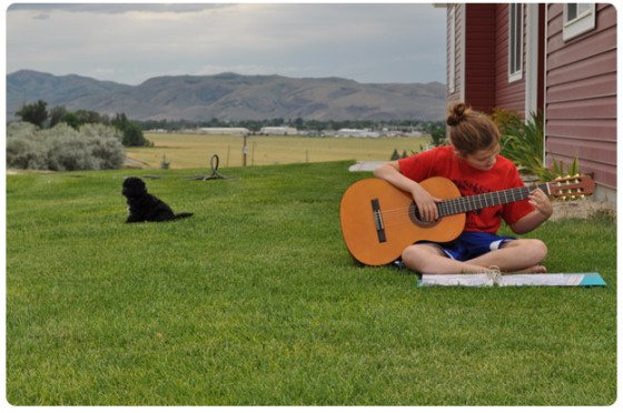 Naomi playing guitar
